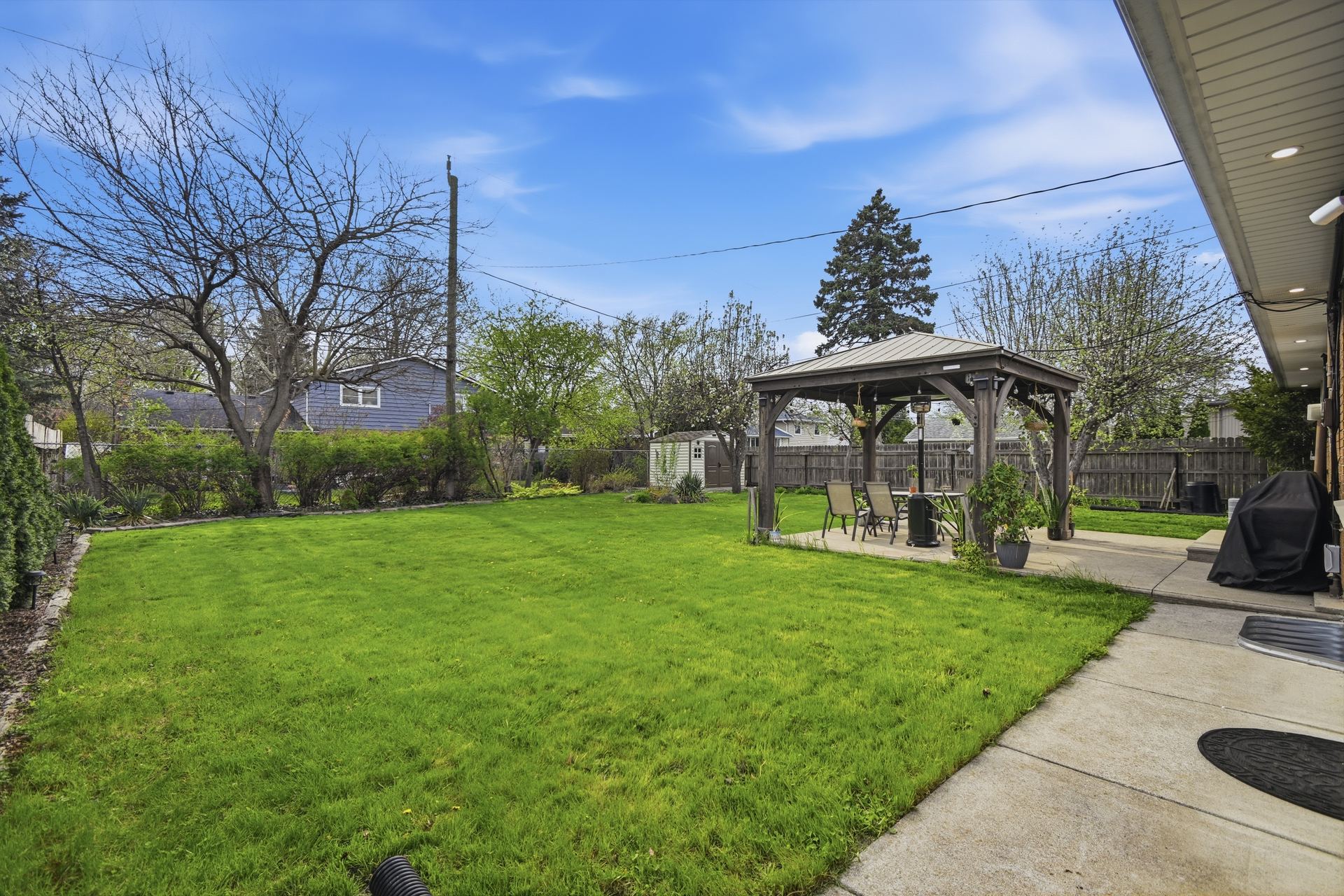 Backyard with new gazebo and shed
